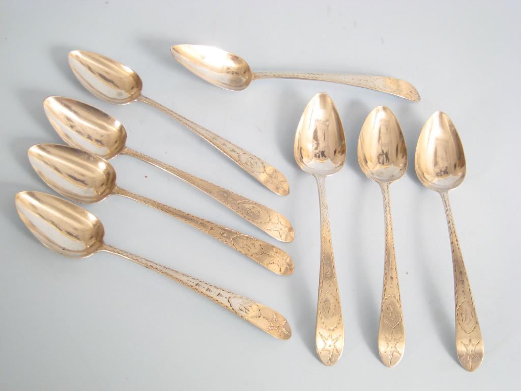 Appraisal: Eight George III Irish Dessert Spoons bright cut and engraved