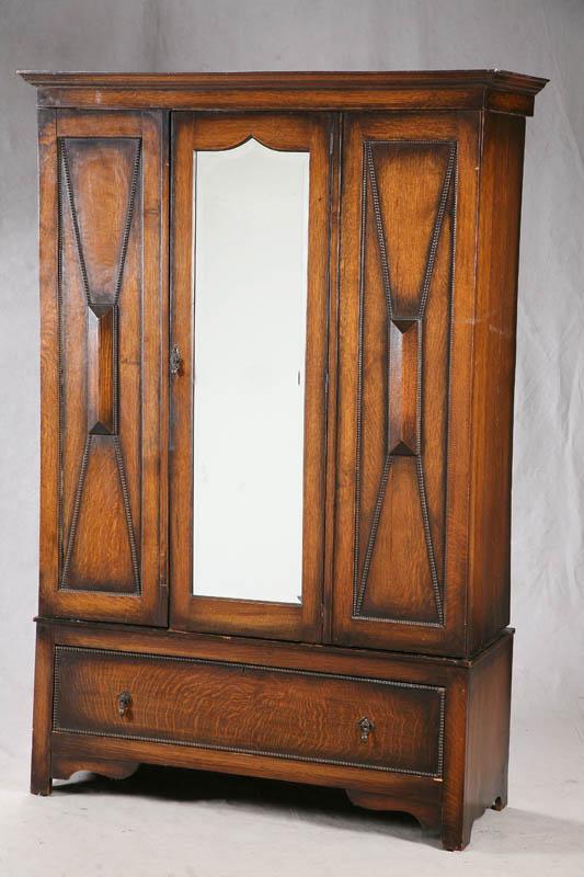 Appraisal: THREE PIECE WARDROBE Oak with a mirrored door in the