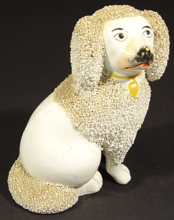 Appraisal: Victorian Staffordshire spaniel modelled with separate front legs with hand