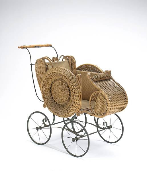 Appraisal: A Victorian rattan baby carriage With wood turned handle and