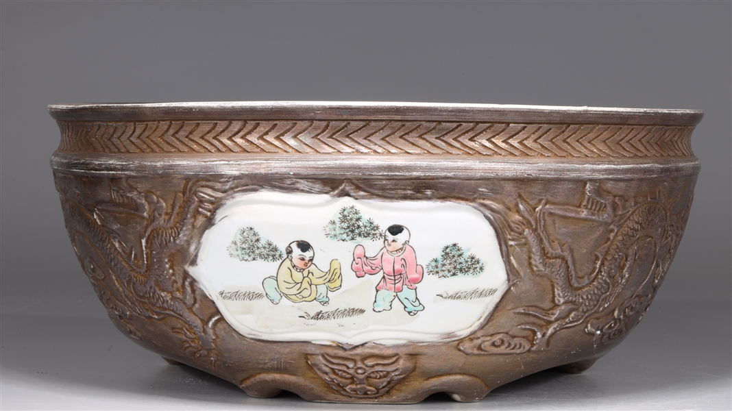 Appraisal: Chinese porcelain silver glazed planter decorated with children playing in