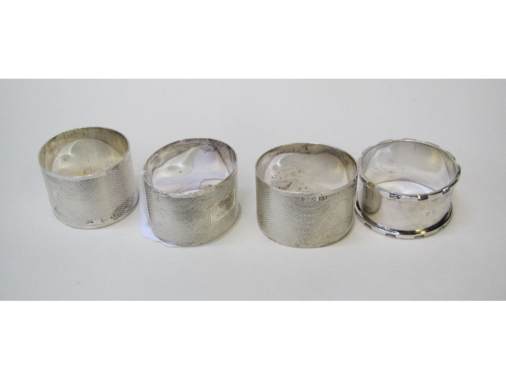 Appraisal: Lot comprising pair of silver napkin rings and two singles