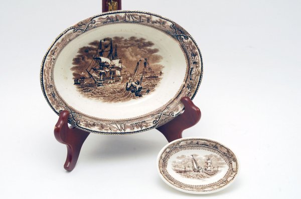 Appraisal: Two brown transfer oval dishes in the American Marine pattern