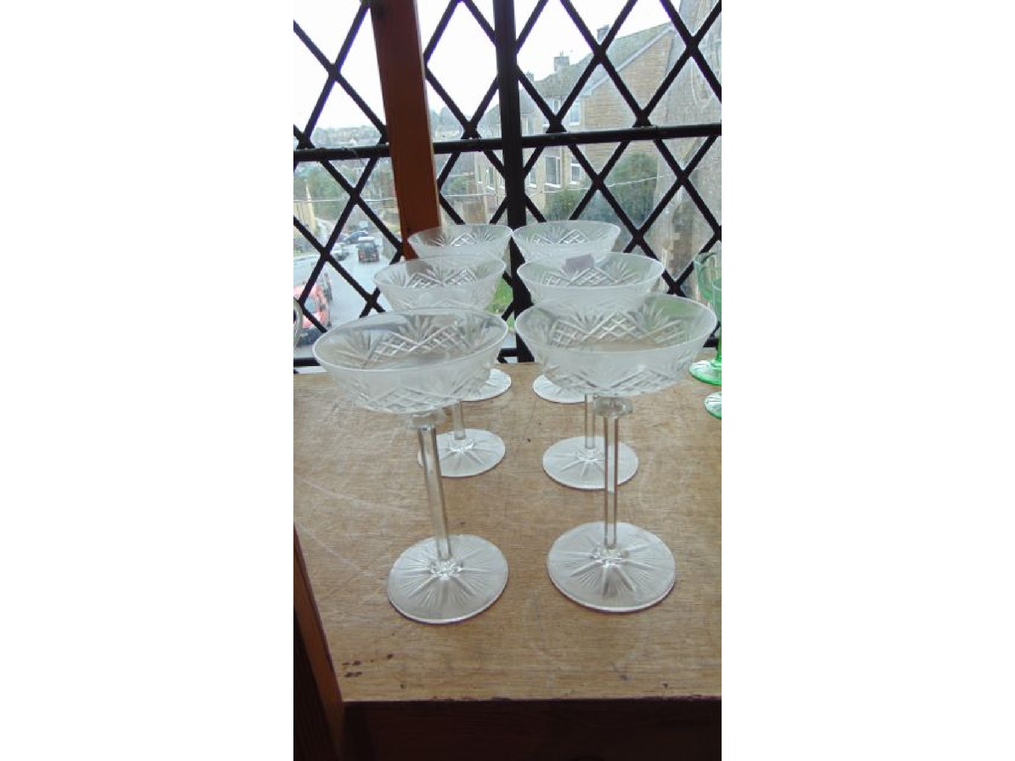 Appraisal: A set of six tall champagne glasses with shallow cross