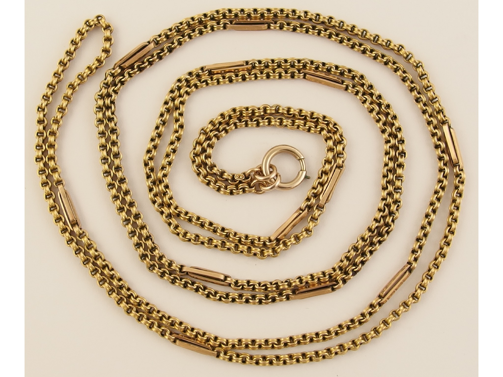 Appraisal: A long ct decorative guard chainof long double links and