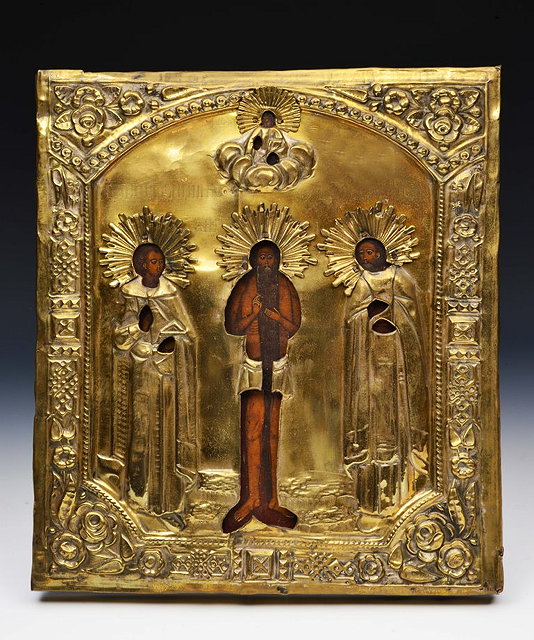 Appraisal: A RUSSIAN ICON with gilt metal frame and painted figures