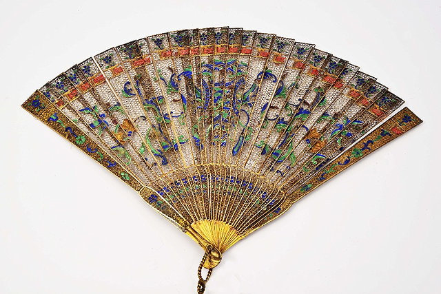 Appraisal: A SILVER GILT AND ENAMEL FAN with delicate filigree panels