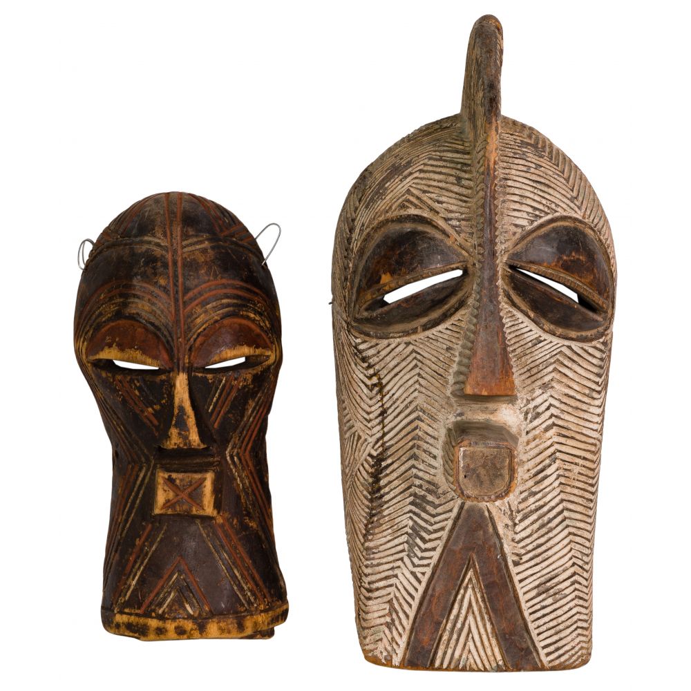 Appraisal: AFRICAN SONGYE CARVED WOOD MASKS masks including a male and