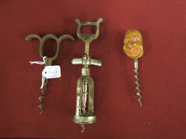 Appraisal: Antique Cork Screws one a carved nut