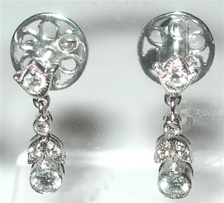 Appraisal: A pair of diamond pendant earrings each composed of a