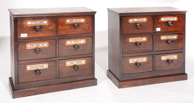 Appraisal: A PAIR OF WOODEN APOTHECARY CABINETS each fitted six drawers