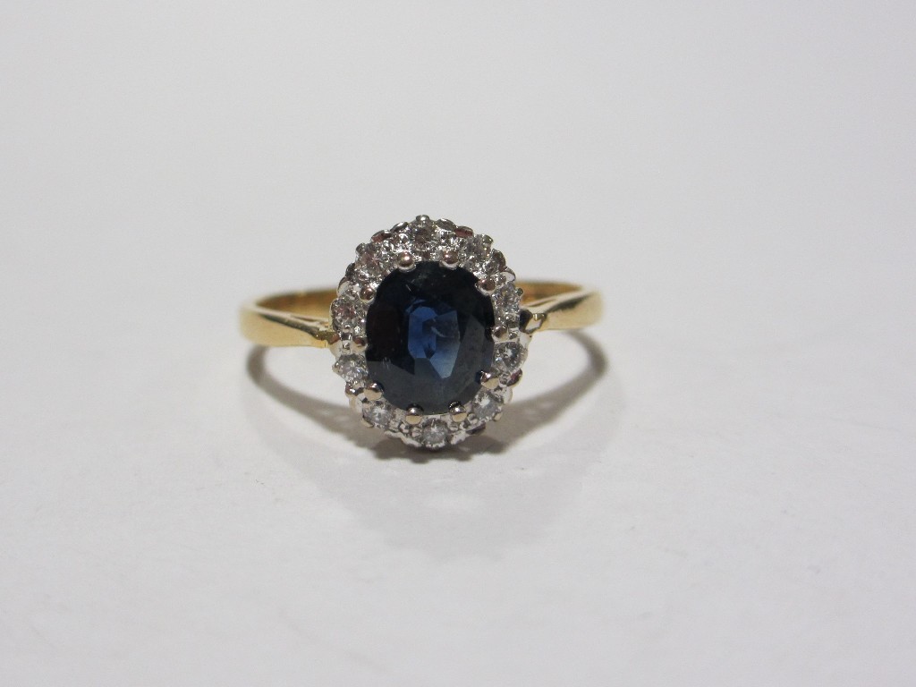 Appraisal: Eighteen carat gold sapphire and diamond cluster ring