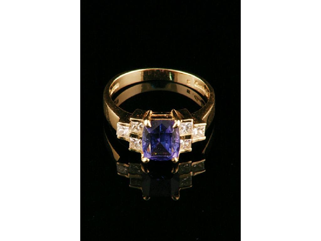 Appraisal: A TANZANITE AND DIAMOND DRESS RING the central cushion-cut tanzanite