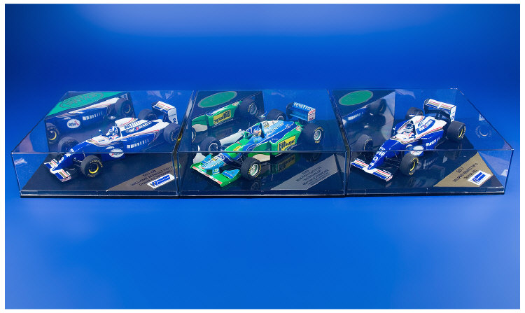 Appraisal: Formula One Cars boxed in clear square cases Bennetton Ford