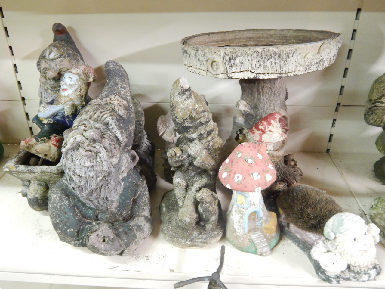 Appraisal: A collection of composition garden gnomes to include fishing figures