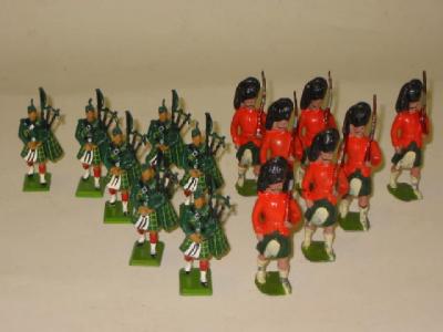 Appraisal: Seven Britains metal Gordon Highlander Pipers E and seven Britains