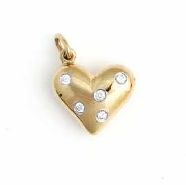 Appraisal: An ct gold 'Etoile' diamond set heart shaped charm by