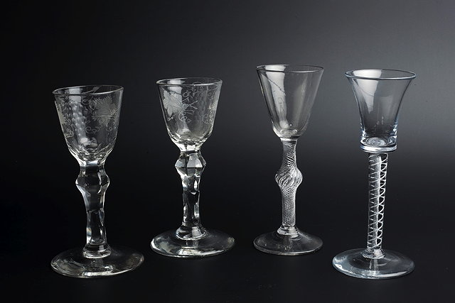 Appraisal: A PAIR OF TH CENTURY WINE GLASSES the bowls engraved