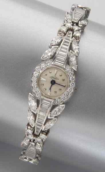 Appraisal: Retro Pery platinum and diamond watchfeaturing round brilliant baguette and