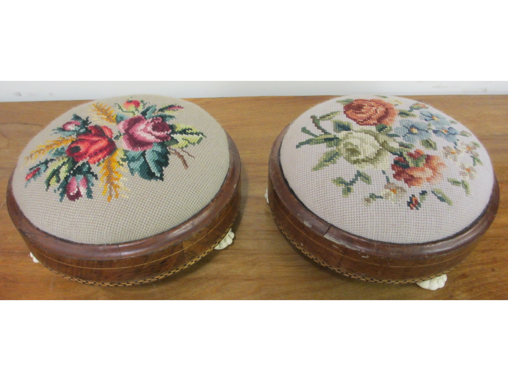 Appraisal: Pair of Victorian walnut and woven wool footstools