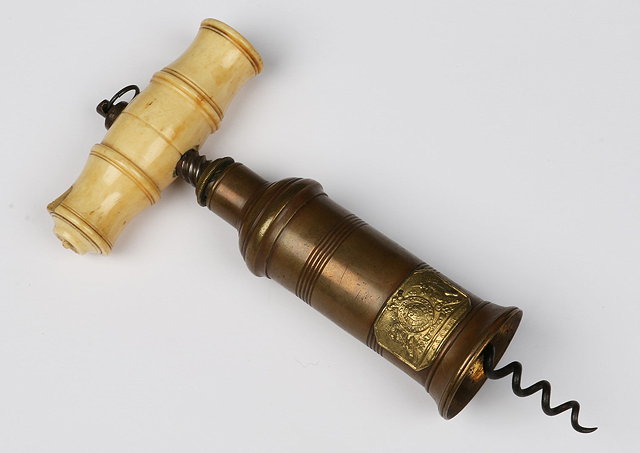 Appraisal: A THOMASON STYLE BRASS BARRELLED CORKSCREW with a turned ivory