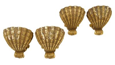 Appraisal: A set of four carved giltwood and gesso wall lights