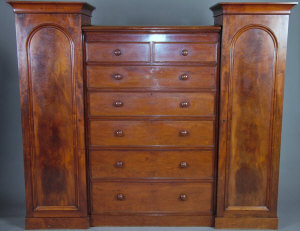 Appraisal: A Victorian mahogany gentleman's wardrobe th century the central chest