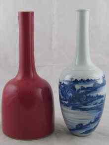 Appraisal: A tall white Chinese vase with slender neck and underglaze