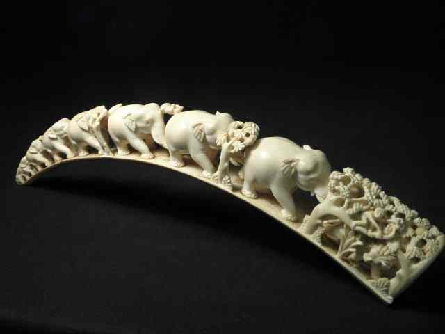 Appraisal: Carved ivory elephant bridge Intricately carved monkey lion and panther