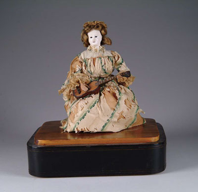 Appraisal: RARE FRENCH MUSICAL AUTOMATON An unusual automaton on an ebonized