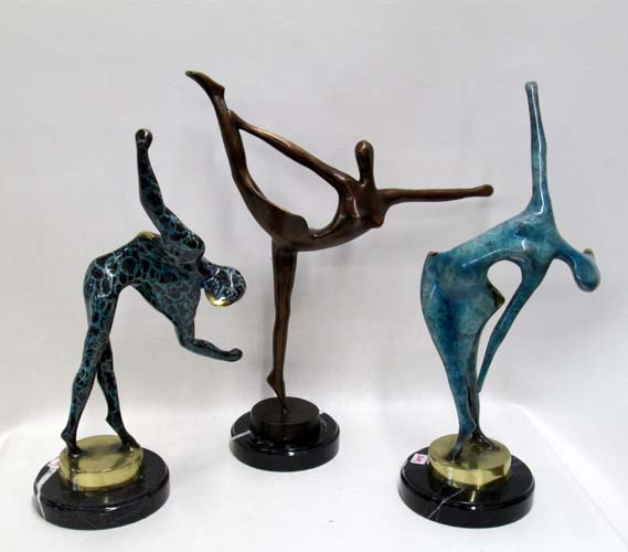 Appraisal: THREE FIGURAL BRONZE SCULPTURES depicting three stylized human forms Heights