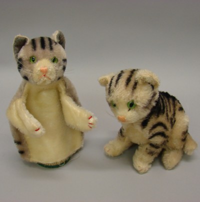 Appraisal: Pair of cats Sitting Susi white mohair with black stripes