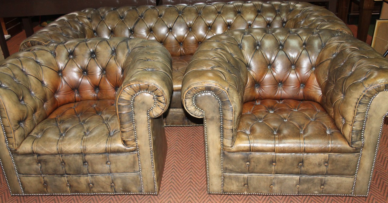 Appraisal: An early thC club three piece leather suite comprising button