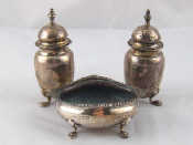 Appraisal: A three piece late Victorian silver cruet set on paw