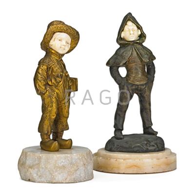 Appraisal: TWO CONTINENTAL FIGURAL BRONZES Two boys with ivory faces marble