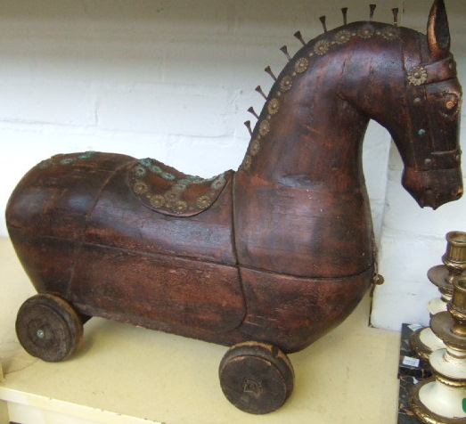 Appraisal: An early th century hardwood model of a horse on