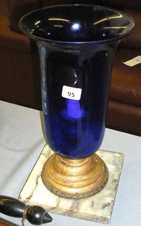 Appraisal: Decorative cobalt blue glass storm lamp upon a turned giltwood