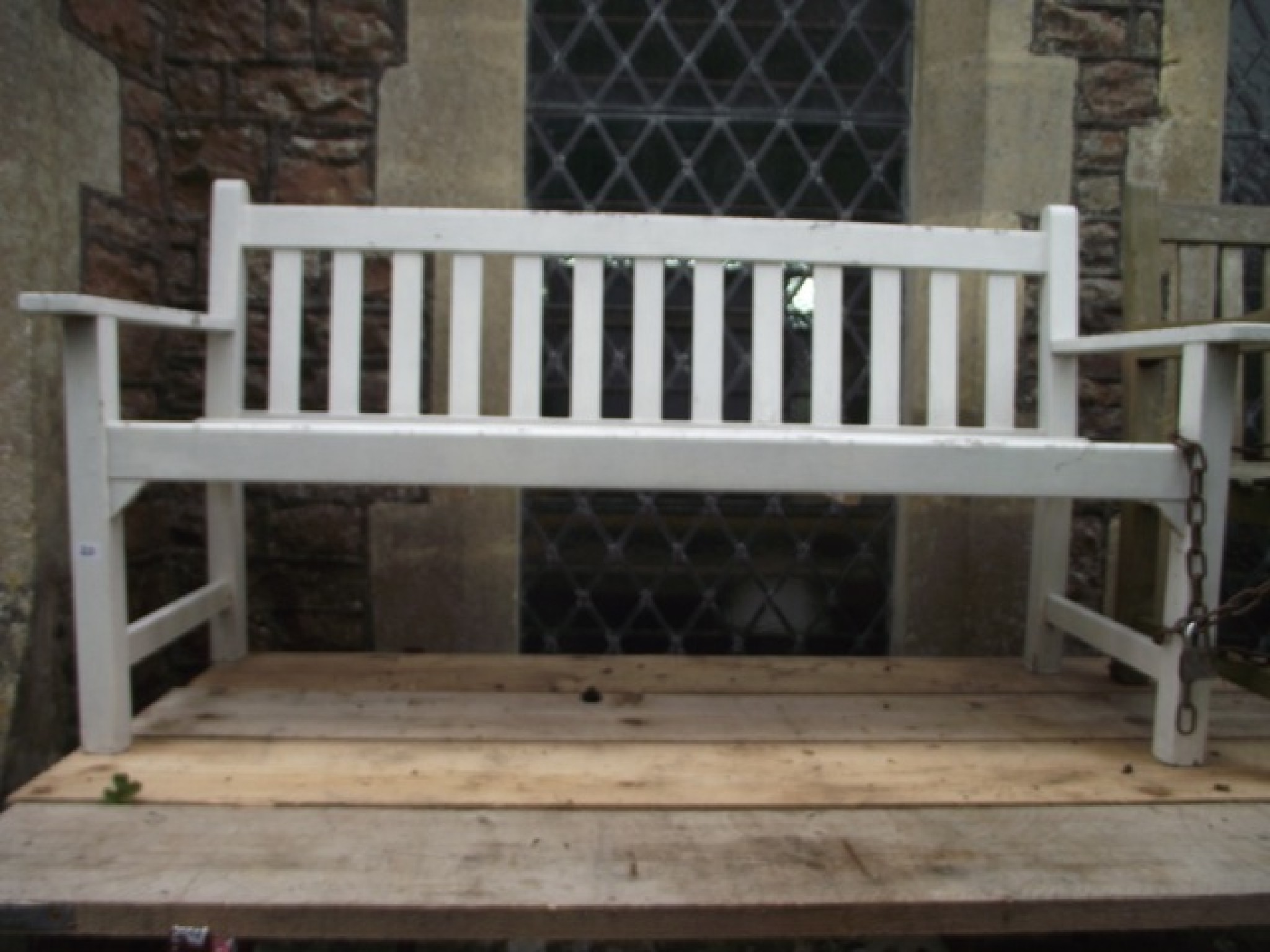 Appraisal: A vintage teak three seat garden bench with slatted seat