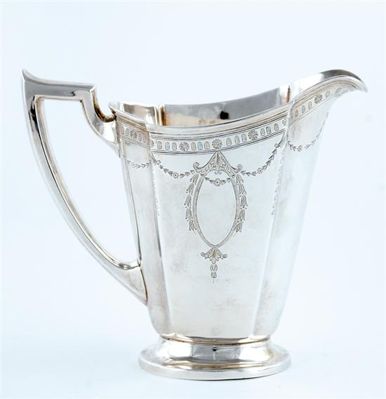 Appraisal: International sterling water pitcher Neoclassical paneled pattern with garland design