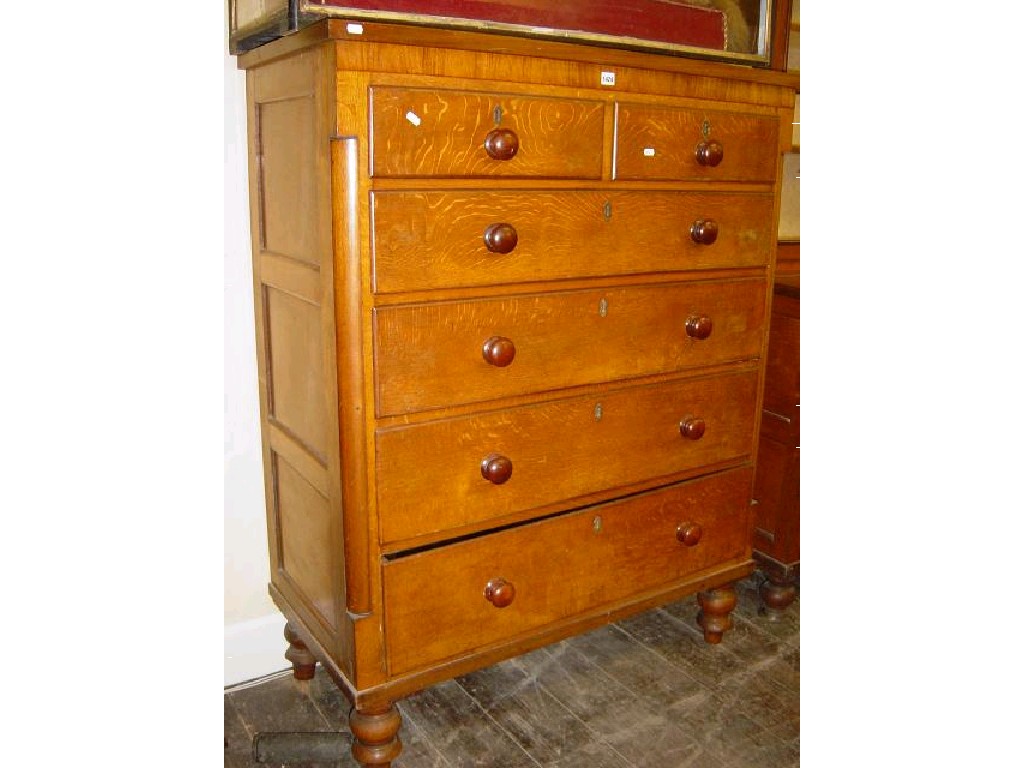 Appraisal: A substantial Victorian oak chest of long and short drawers