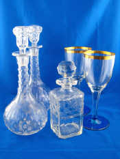 Appraisal: Cut glass A pair of decanters and a whisky decanter