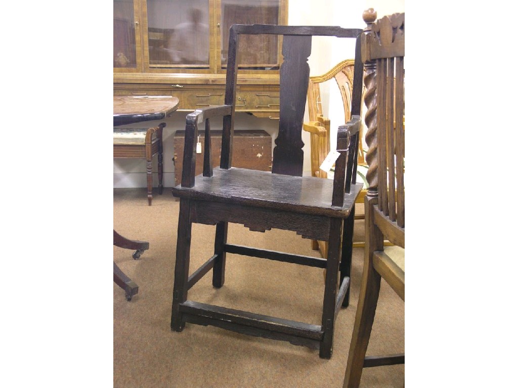 Appraisal: A dark stained wood carver chair with vase splat solid