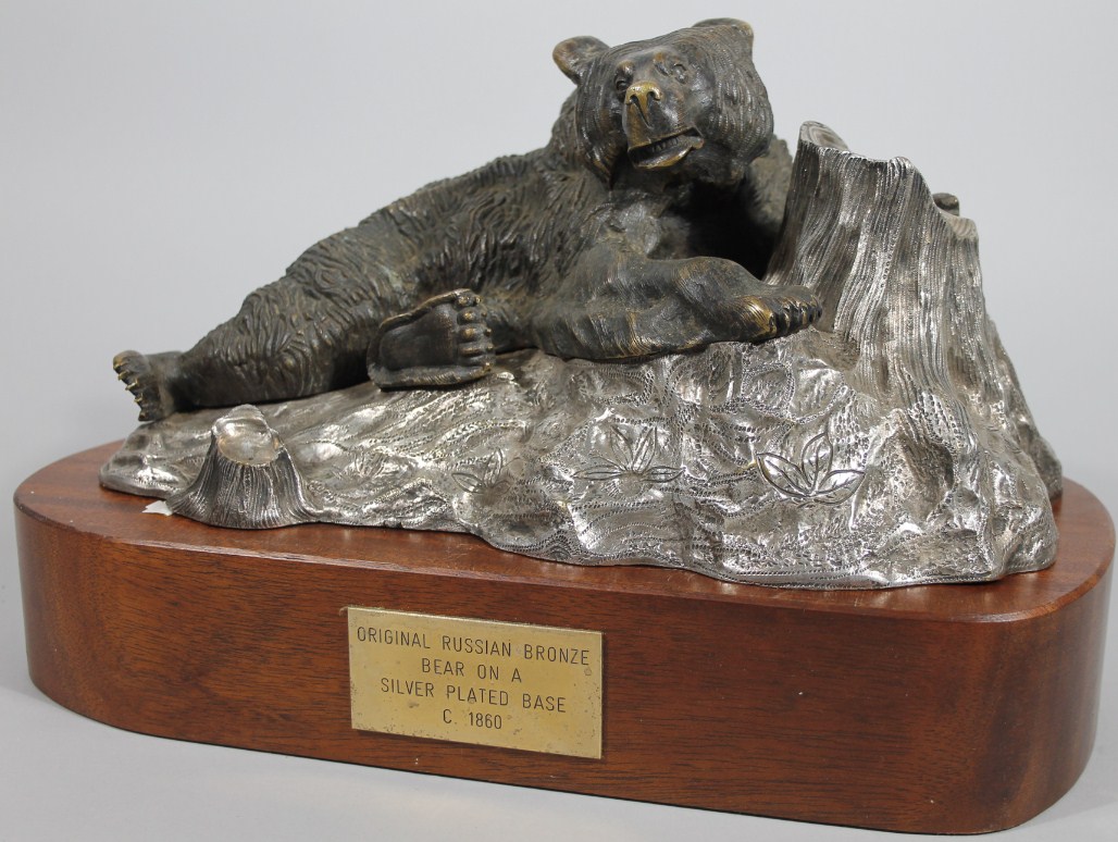 Appraisal: A hollow cast bronze finish figure group of a recumbent