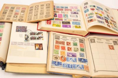 Appraisal: Two Strand stamp albums containing all world collections a Victory