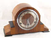 Appraisal: A s eight day walnut mantel clock with strike silent