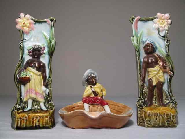 Appraisal: Includes two Majolica pottery pitchers with male and female black