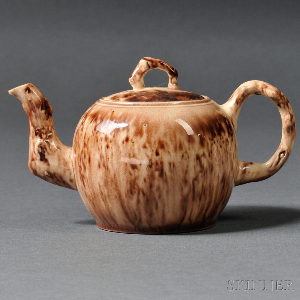 Appraisal: Staffordshire Cream-colored Earthenware Teapot and Cover England c globular shape