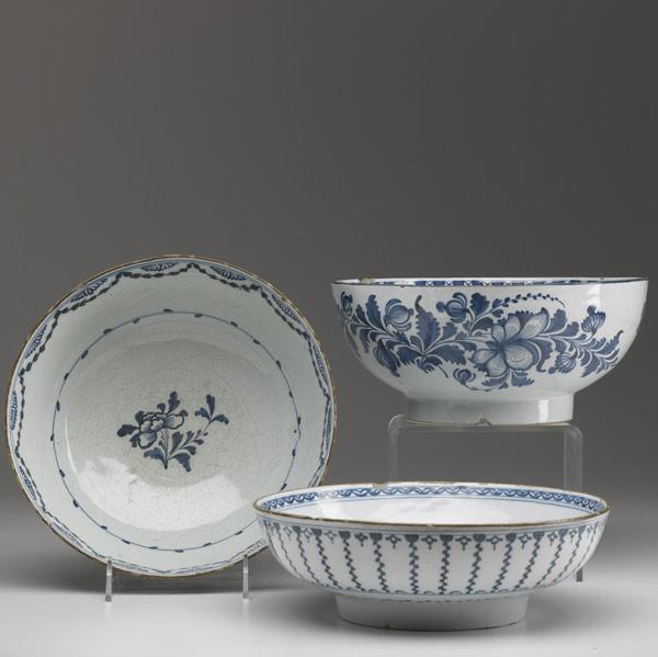 Appraisal: DELFT Three deep bowls with floral decoration th C Largest