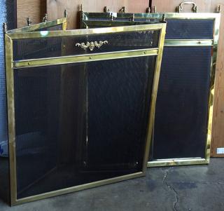 Appraisal: Pair of Neoclassical style brass fire screens each having scroll