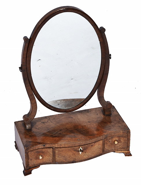 Appraisal: A GEORGE III MAHOGANY OVAL SWING TOILET MIRROR the serpentine